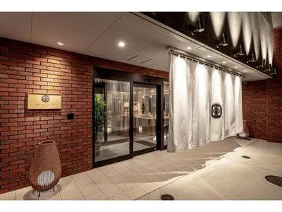 a room with a brick wall and a window at Prostyle Ryokan Tokyo Asakusa - Vacation STAY 48261v in Tokyo