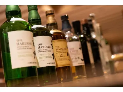 a row of wine bottles sitting on a shelf at Prostyle Ryokan Tokyo Asakusa - Vacation STAY 48262v in Tokyo