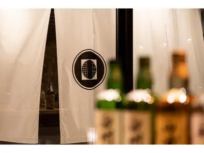 a black and white curtain with bottles of wine at Prostyle Ryokan Tokyo Asakusa - Vacation STAY 48262v in Tokyo