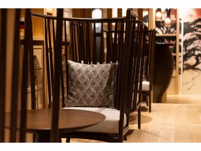 a chair with a pillow next to a table at Prostyle Ryokan Tokyo Asakusa - Vacation STAY 48263v in Tokyo