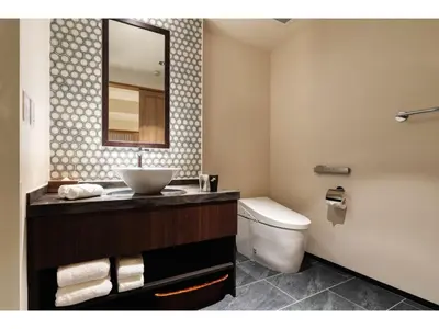 a bathroom with a sink and a toilet and a mirror at Prostyle Ryokan Tokyo Asakusa - Vacation STAY 48264v in Tokyo