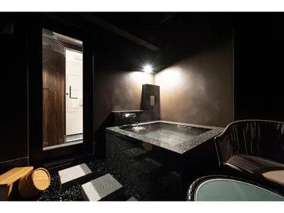 a black bathroom with a tub and a window at Prostyle Ryokan Tokyo Asakusa - Vacation STAY 48264v in Tokyo