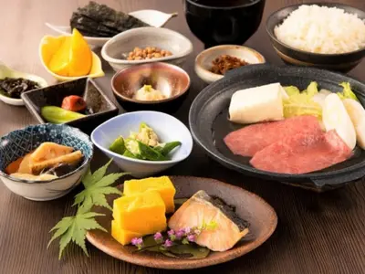 a table with plates of food and bowls of food at Prostyle Ryokan Tokyo Asakusa - Vacation STAY 48265v in Tokyo
