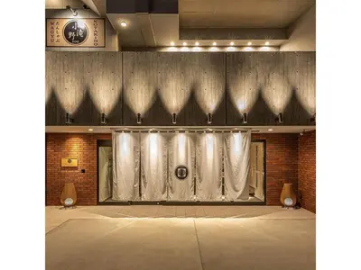 a room with white curtains and a brick wall at Prostyle Ryokan Tokyo Asakusa - Vacation STAY 48265v in Tokyo