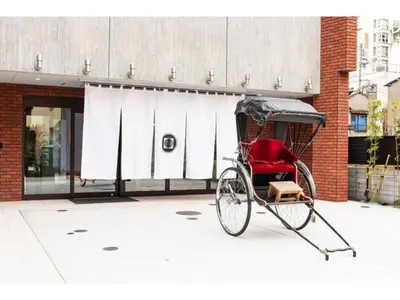 a red rickshaw parked in front of a building at Prostyle Ryokan Tokyo Asakusa - Vacation STAY 48267v in Tokyo