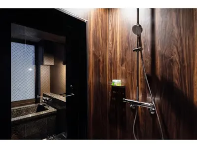 a bathroom with a shower with a sink and a mirror at Prostyle Ryokan Tokyo Asakusa - Vacation STAY 48266v in Tokyo