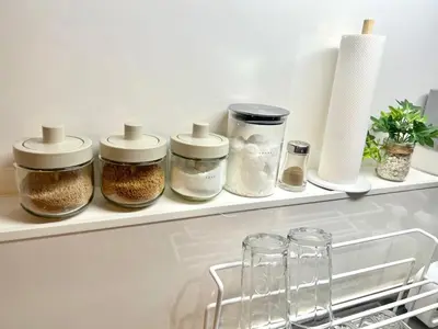 a shelf in a kitchen with spices in jars at Vista Ikegami 202 - Vacation STAY 17403 in Tokyo