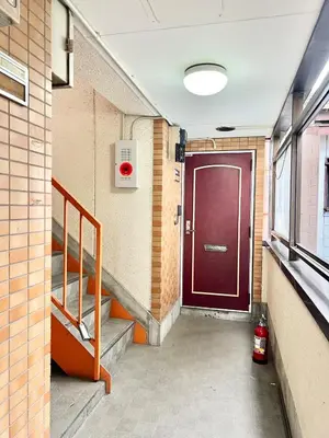 a hallway with a red door in a building at Vista Ikegami 202 - Vacation STAY 17403 in Tokyo