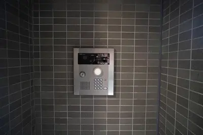 a soap dispenser on a tiled wall in a bathroom at \u65e5\u672c\u306e\u4e0b\u753a\u65b0\u5c0f\u5ca9\u30c7\u30e1\u30c6\u30eb202 in Tokyo