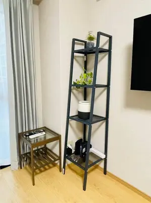 a black shelf in a room with a table at \u65b0\u5c0f\u5ca9\u30c7\u30e1\u30c6\u30eb303 in Tokyo