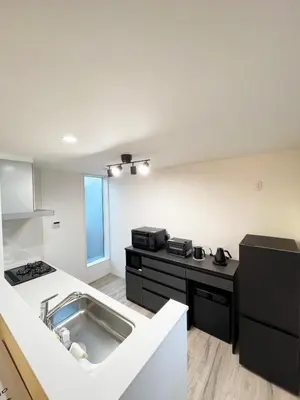 a kitchen with a sink and a stove at japan house JCA\u99c5\u5f92\u6b693\u5206 \u30f4\u30a3\u30e9\u8cb8\u5207\u304a\u3057\u3083\u308c\u306a\u7a7a\u9593 in Tokyo