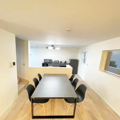 a dining room with a table and chairs at japan house JCA\u99c5\u5f92\u6b693\u5206 \u30f4\u30a3\u30e9\u8cb8\u5207\u304a\u3057\u3083\u308c\u306a\u7a7a\u9593 in Tokyo