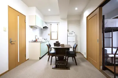 a kitchen and dining room with a table and chairs at Swan Lake Inn Shinjuku Room 501 - Vacation STAY 16588 in Tokyo