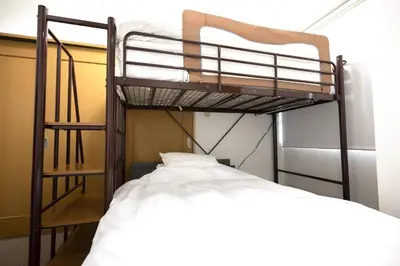 a bedroom with two bunk beds in a room at Swan Lake Inn Shinjuku Room 501 - Vacation STAY 16588 in Tokyo