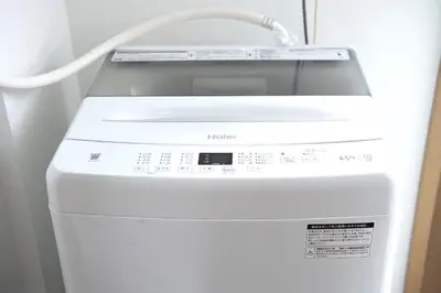a washing machine with a white cord on top of it at Swan Lake Inn Shinjuku Room 501 - Vacation STAY 16588 in Tokyo