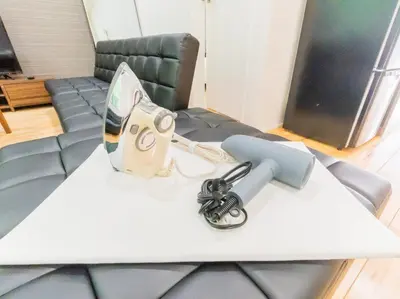 a table with a toy gun on top of it at BH Terace 102 - Vacation STAY 17368 in Tokyo