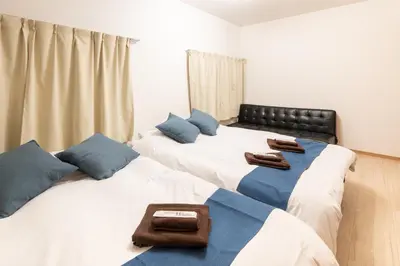 two beds sitting next to each other in a room at A to - Vacation STAY 17369 in Tokyo