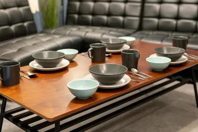 a wooden table with bowls and silverware on it at A to - Vacation STAY 17369 in Tokyo