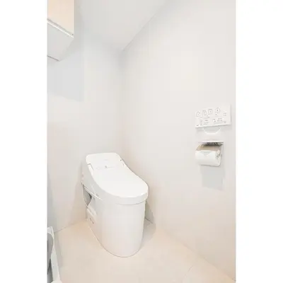 a bathroom with a toilet in a white room at japan house T-Plaza sugamo in Tokyo