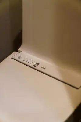 a white refrigerator with a control panel on top of it at 70m2 House in central Tokyo in Tokyo