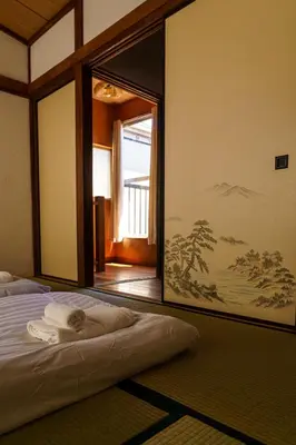 a room with a bed with a large mirror at 70m2 House in central Tokyo in Tokyo
