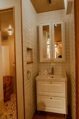 a white bathroom with a sink and a mirror at 70m2 House in central Tokyo in Tokyo