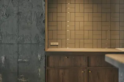 a bathroom with a sink and a mirror at illi Rom Hamamatsucho in Tokyo