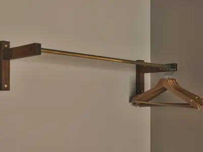 a wooden rack with a broom on a wall at illi Rom Hamamatsucho in Tokyo