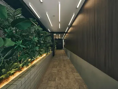 a hallway with plants on the walls of a building at illi Rom Hamamatsucho in Tokyo