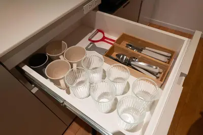 a drawer with a bunch of cups and a pair of scissors at \u30a2\u30f3\u30c9\u30b9\u30c6\u30a4\u6771\u5411\u5cf66\u4e01\u76ee302 Soi house in Tokyo