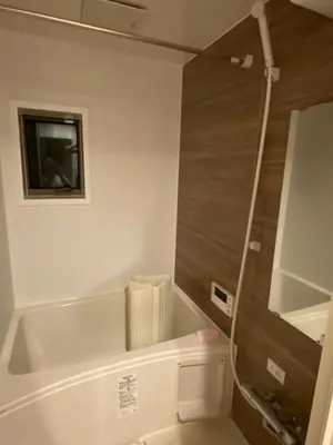 a bathroom with a tub and a toilet and a sink at \u4ec1\u6e90\u5bbf in Tokyo