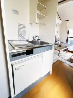a white kitchen with a sink and a counter at \u5f25\u751f\u753a1\u4e01\u76ee206 in Tokyo