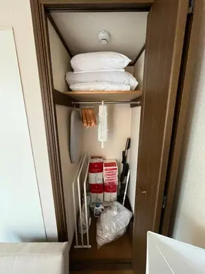 a small closet with towels and other items in it at \u5f25\u751f\u753a1\u4e01\u76ee206 in Tokyo