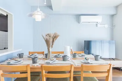 a dining room with a table and chairs at Spacious 1120feet , 3-Bedroom Apartment near Ikebukuro, 2 Minutes to Train in Tokyo