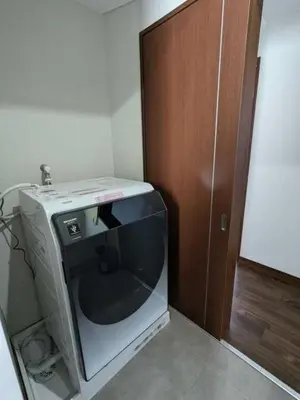 a computer monitor sitting next to a wooden door at Senzoku 21 - Vacation STAY 69137v in Tokyo
