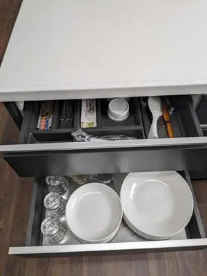 a drawer with plates and dishes in a cabinet at Senzoku 21 - Vacation STAY 69137v in Tokyo