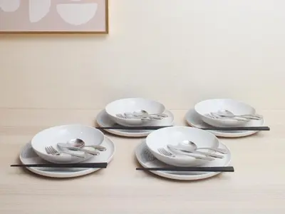 four dishes with birds on them on a table at tokyo Japandi apartment ikebukuro in Tokyo