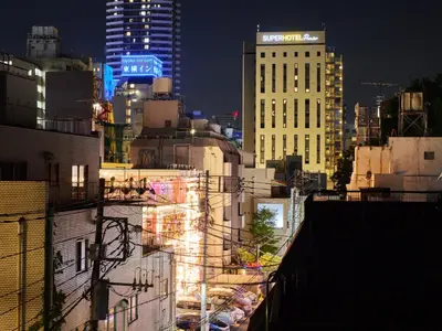 a view of a city at night with buildings at tokyo Japandi apartment ikebukuro in Tokyo