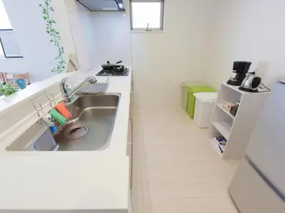 a small kitchen with a sink and a toilet at Sugamototate - Vacation STAY 50637v in Tokyo