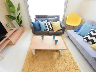 a living room with a couch and a coffee table at Sugamototate - Vacation STAY 50637v in Tokyo