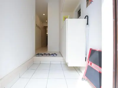 a hallway with a row of shoes in a room at Sugamototate - Vacation STAY 50637v in Tokyo