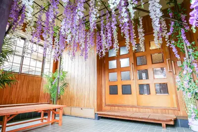 a building with purple flowers hanging from the ceiling at Urayasu Villa in Tokyo