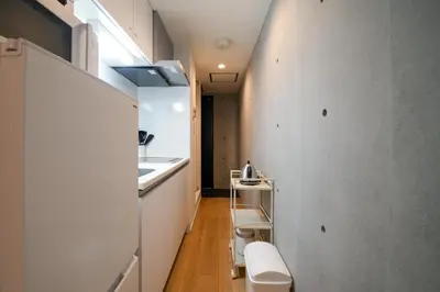 a small bathroom with a sink and a toilet at Fullea Yotsuya in Tokyo