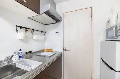 a kitchen with a sink and a refrigerator at Real Waseda SJ0261 in Tokyo