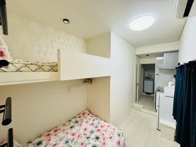 a small room with a bed and a kitchen at Real Waseda SJ0261 in Tokyo