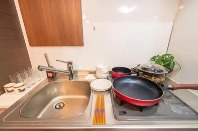 a kitchen sink with a frying pan on it at \u79cb\u53f6\u539f\u5609\u967d\u30d3\u30eb in Tokyo