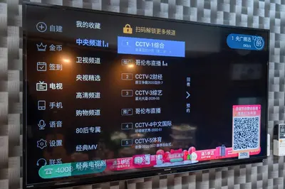 a large television screen in a store withinese writing on it at \u79cb\u53f6\u539f\u5609\u967d\u30d3\u30eb in Tokyo