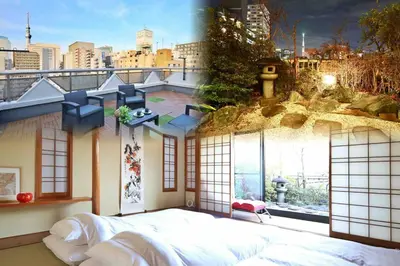 a large bedroom with a view of a city at \u9326\u7cf8\u753a\u5f92\u6b694\u5206210\u5e73\u7c73\u5927\u7a7a\u9593\u548c\u98a8\u5ead\u5712\u30c6\u30e9\u30b9\u30b9\u30ab\u30a4\u30c4\u30ea\u30fc\u30d3\u30e5\u30fc\u7573\u90e8\u5c4b in Tokyo
