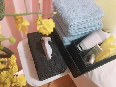 a black box with towels and towels on a table at B & K Nakanosakaue in Tokyo