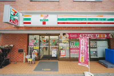 a store front of a brick building with signs at \u6771\u4eac\u30ea\u30ea\u30a2\u30eb\u30db\u30c6\u30eb601 in Tokyo